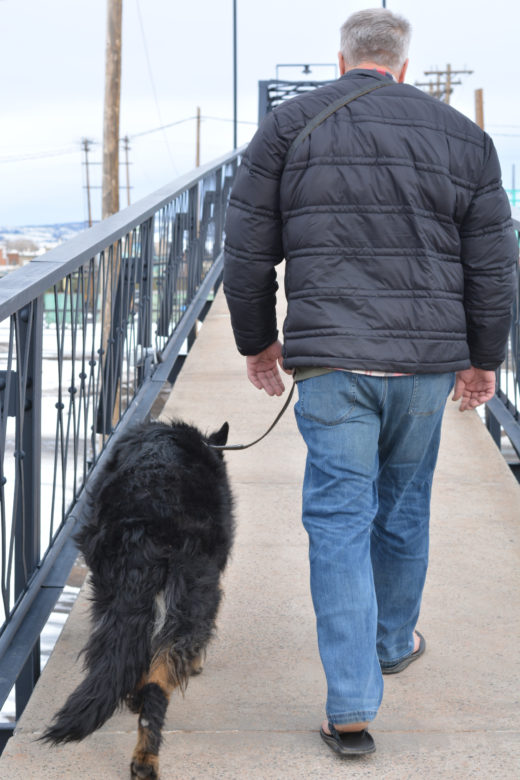 Man walking dog on leash